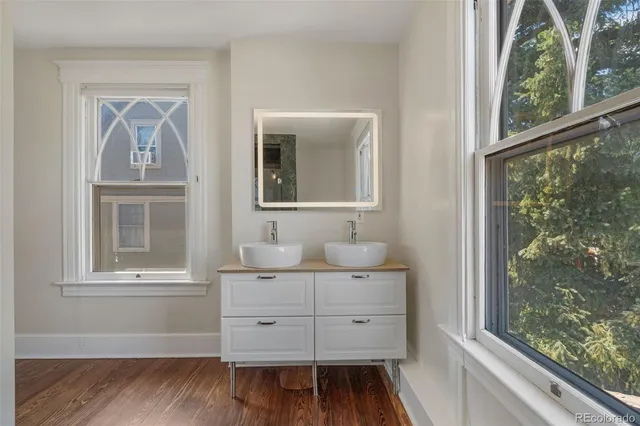 a view of a door and wooden floor