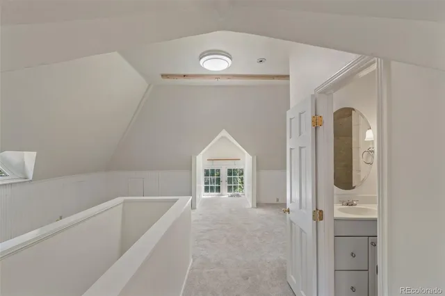 a bathroom with a bathtub and a window
