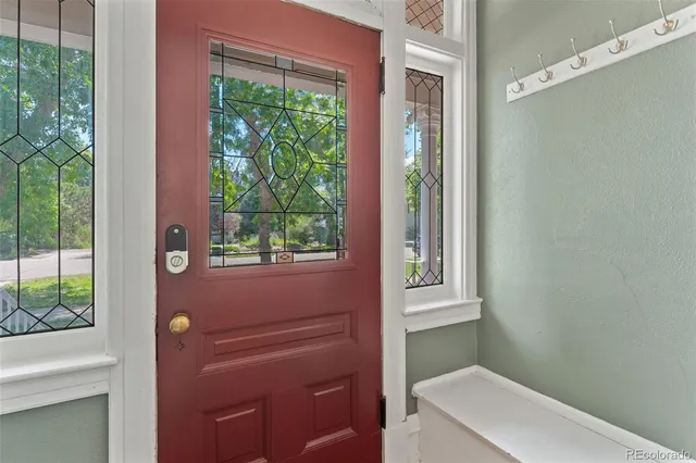 a bathroom with a toilet a sink and a window