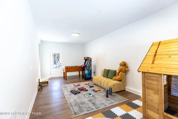 a living room with furniture and a rug