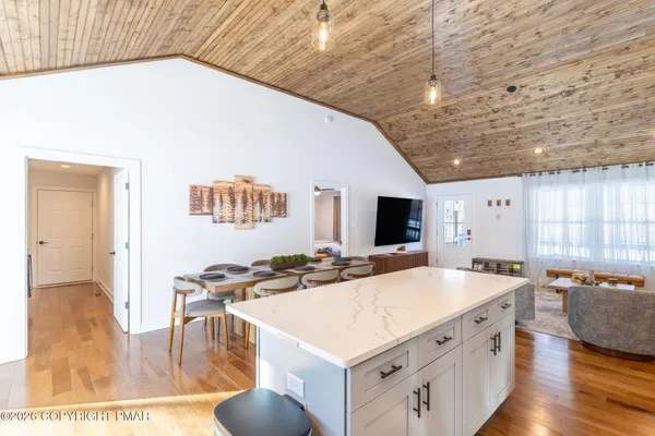 a kitchen with stainless steel appliances a sink a stove and a refrigerator