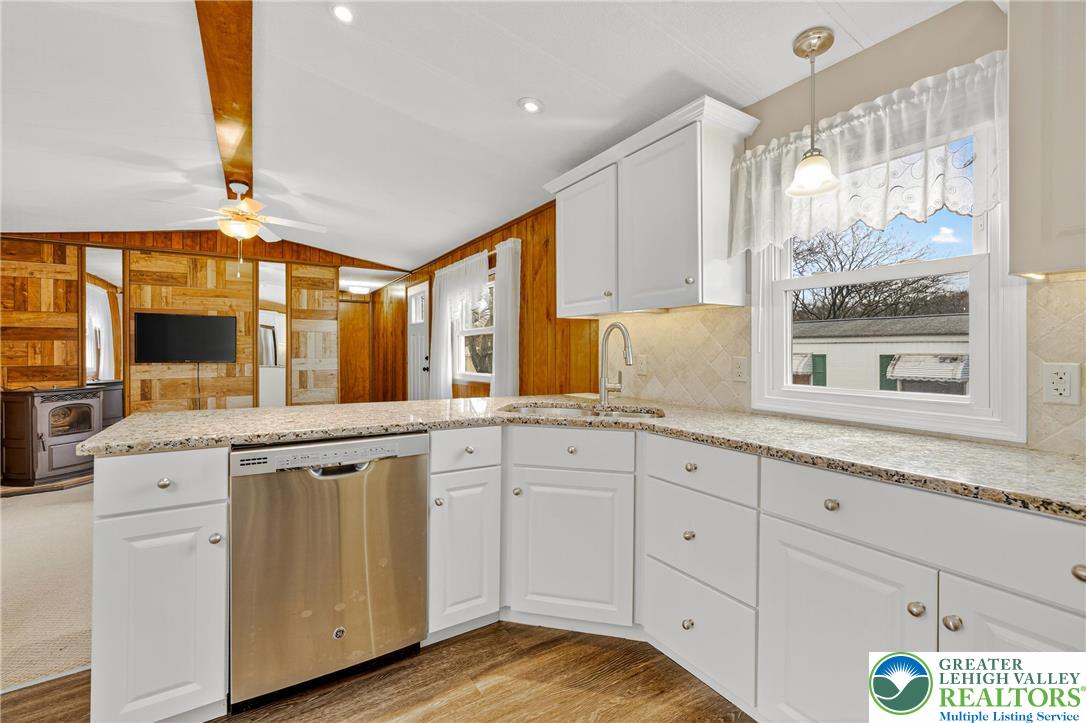 12 Revolutionary Road Mount Bethel, PA 18343 - Photo 11 of 53 a kitchen with granite countertop white cabinets and white appliances