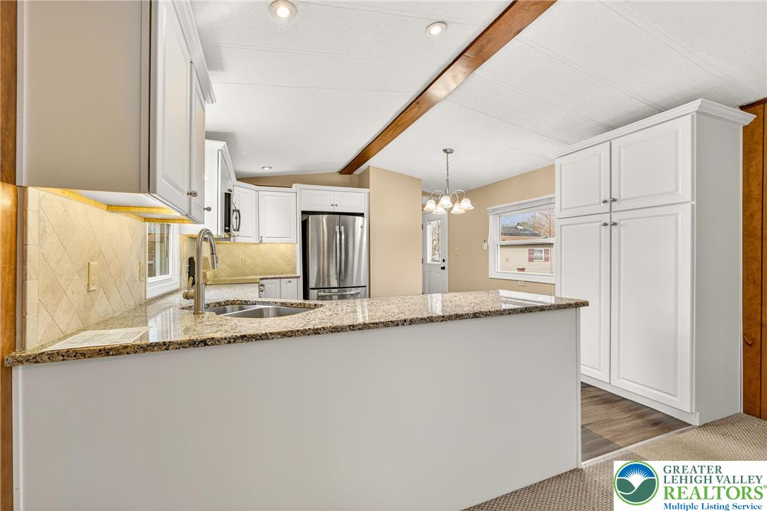 12 Revolutionary Road Mount Bethel, PA 18343 - Photo 12 of 53 a kitchen with stainless steel appliances granite countertop a sink and a granite counter tops