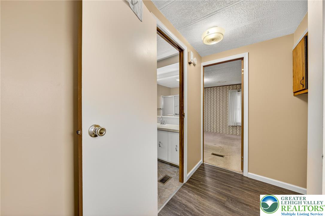 12 Revolutionary Road Mount Bethel, PA 18343 - Photo 18 of 53 a view of a hallway with wooden floor
