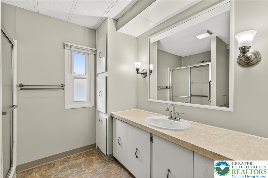 12 Revolutionary Road Mount Bethel, PA 18343 - Photo 21 of 53 a bathroom with a sink and a mirror