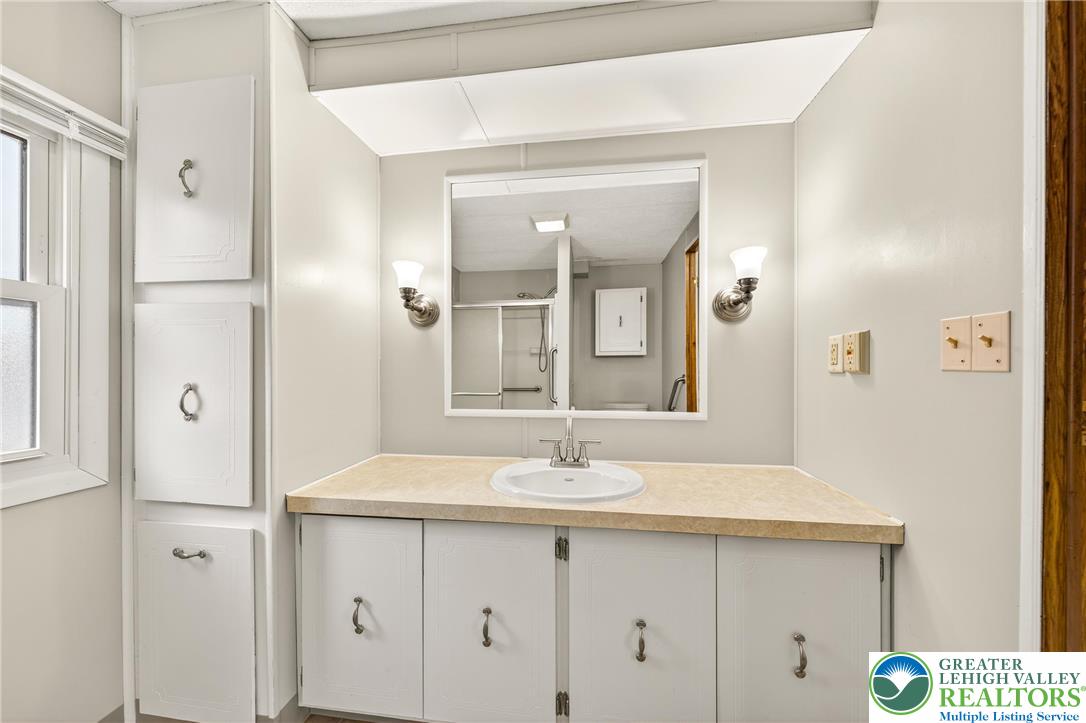 12 Revolutionary Road Mount Bethel, PA 18343 - Photo 22 of 53 a bathroom with a sink and a mirror