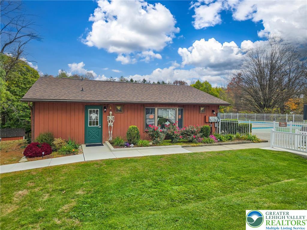 12 Revolutionary Road Mount Bethel, PA 18343 - Photo 46 of 53 a front view of a house with a yard and garage