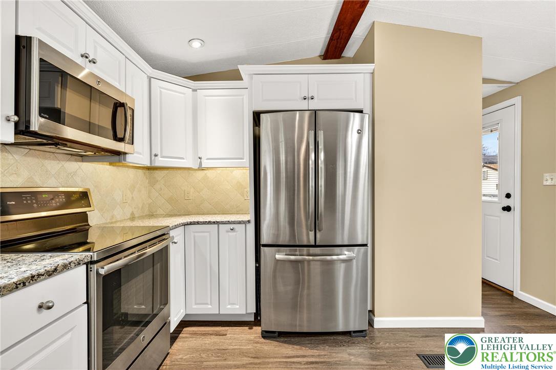 12 Revolutionary Road Mount Bethel, PA 18343 - Photo 8 of 53 a kitchen with appliances a microwave and cabinets