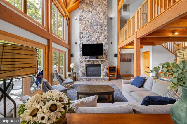 a large kitchen with kitchen island granite countertop a large window