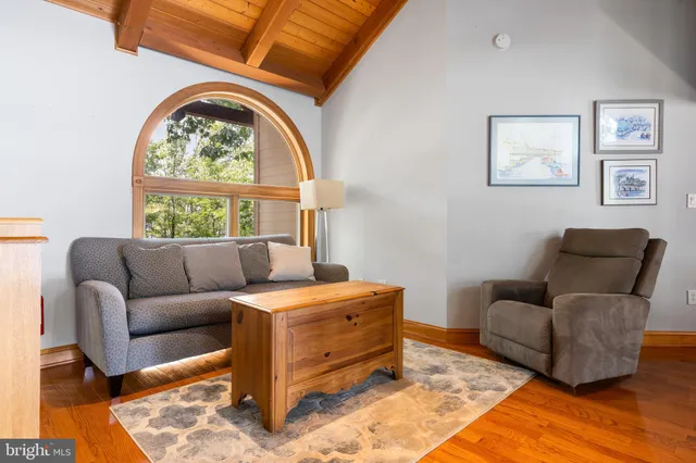 a bathroom with a granite countertop sink and a large mirror