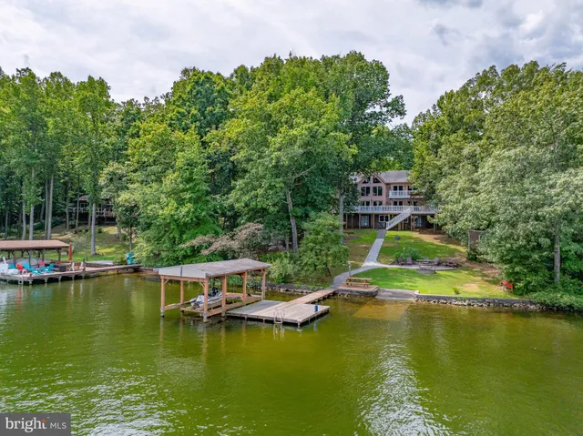 an aerial view of a houses with ocean view