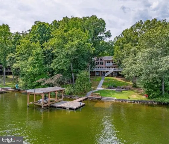 a view of a porch with a table and chairs