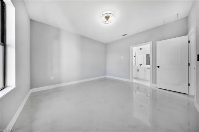 an empty room with windows