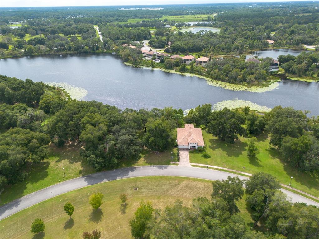 3613 Azurite Court DeLand, FL 32724 - Photo 10 of 20 an aerial view of residential houses with outdoor space and lake view