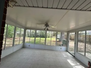 a view of an empty room with windows