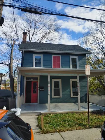 a front view of a house with yard