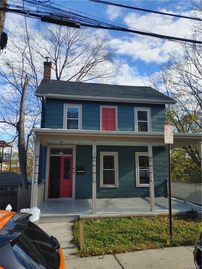 a front view of a house with yard