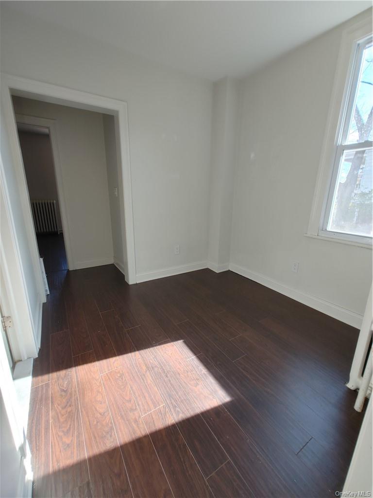 7 Prospect Street, Unit 1 Nyack, NY 10960 - Photo 15 of 18 wooden floor in a bedroom next to a window