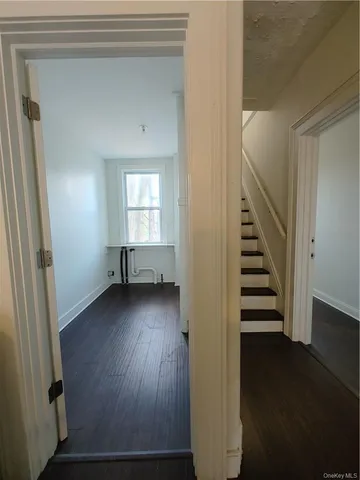 a view of entryway with wooden floor