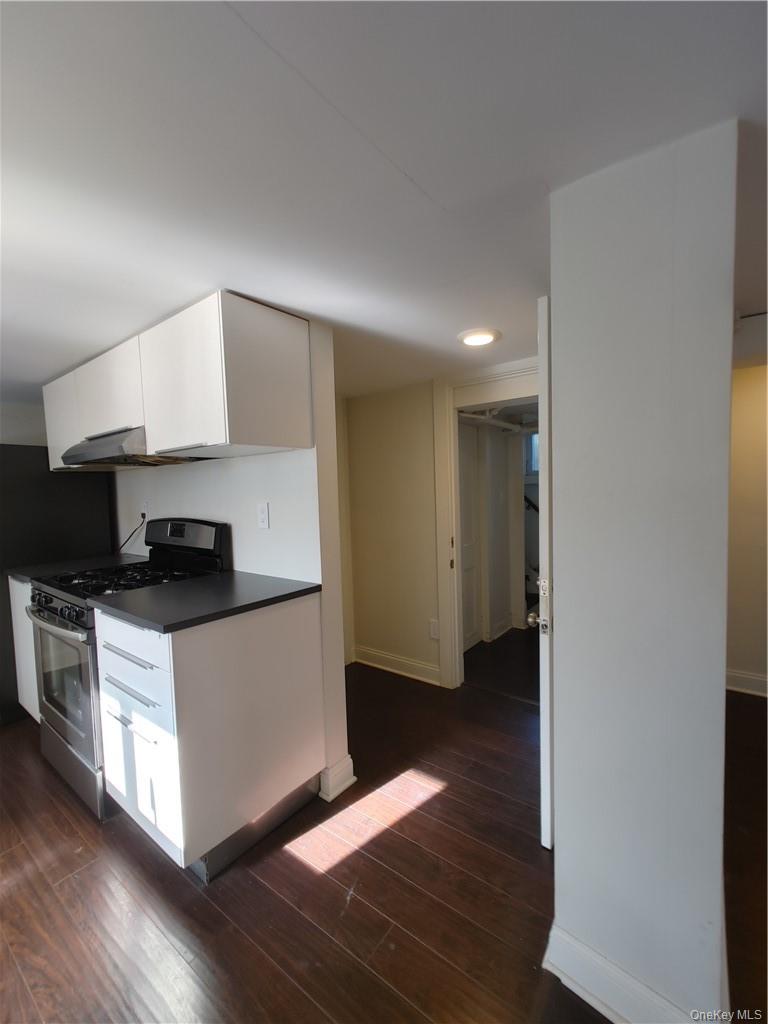 7 Prospect Street, Unit 1 Nyack, NY 10960 - Photo 8 of 18 a kitchen with granite countertop a stove and a refrigerator