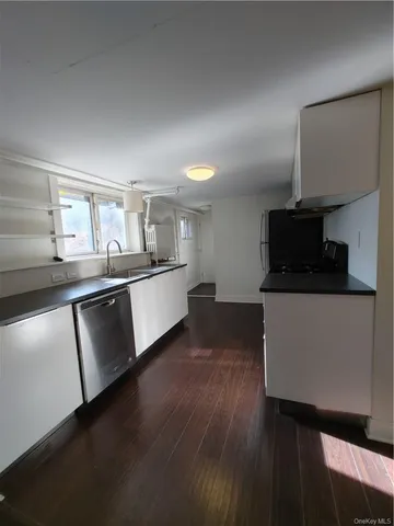 a bathroom with a sink toilet and mirror