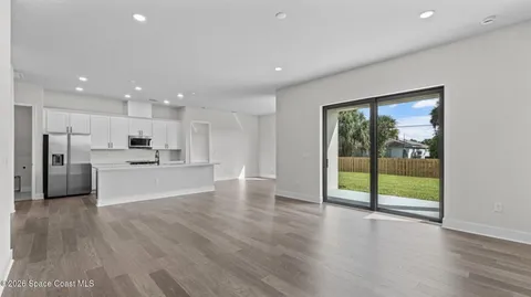 a view of a kitchen with a sink and a window