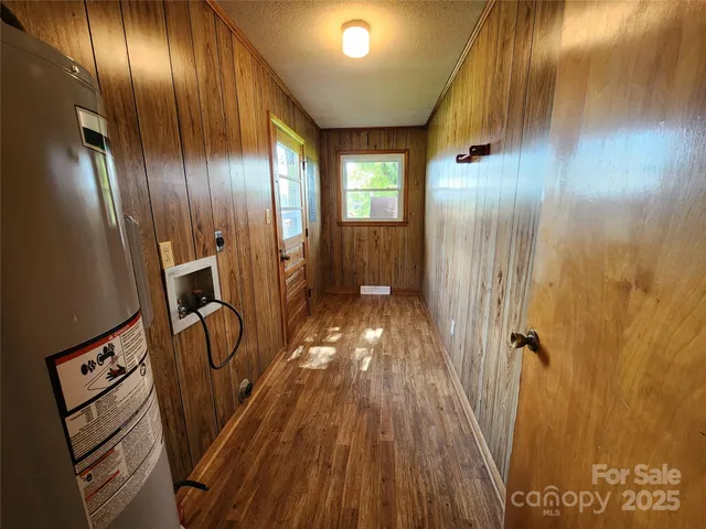 a view of a elevator with wooden floor