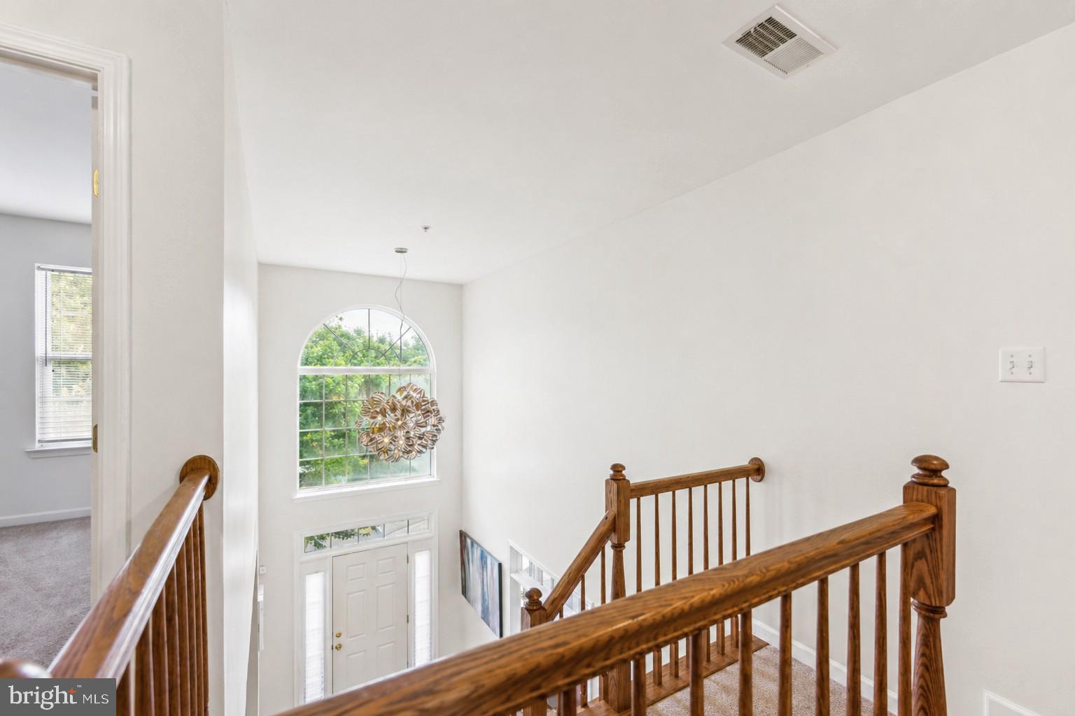 10103 Rolling Green Way Fort Washington, MD 20744 - Photo 20 of 39 a view of staircase with white walls and a window