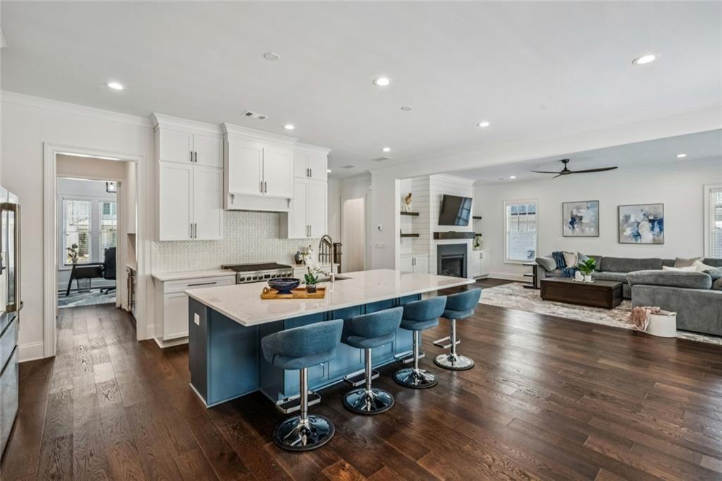 4081 Longleaf Lane Tucker, GA 30084 - Photo 12 of 49 a room with stainless steel appliances a dining table wooden floor and a view of kitchen