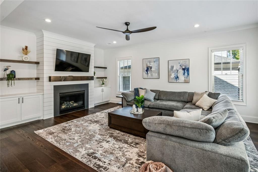 4081 Longleaf Lane Tucker, GA 30084 - Photo 15 of 49 a living room with furniture a flat screen tv and a fireplace