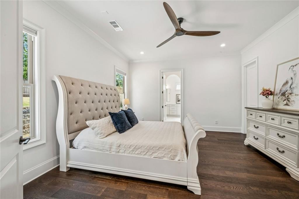 4081 Longleaf Lane Tucker, GA 30084 - Photo 20 of 49 a bedroom with a bed and a chandelier