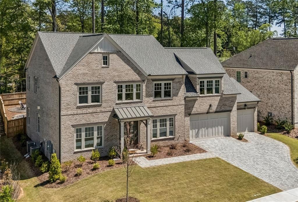 4081 Longleaf Lane Tucker, GA 30084 - Photo 2 of 49 a view of a white house with large windows next to a road