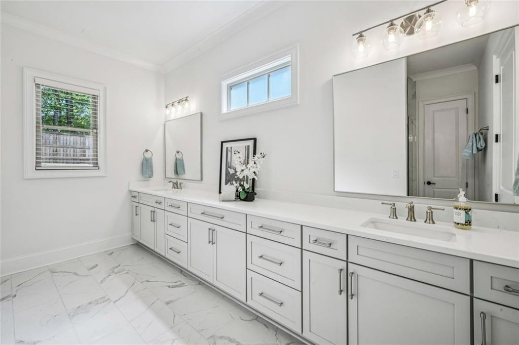 4081 Longleaf Lane Tucker, GA 30084 - Photo 21 of 49 a bathroom with double sink and a mirror