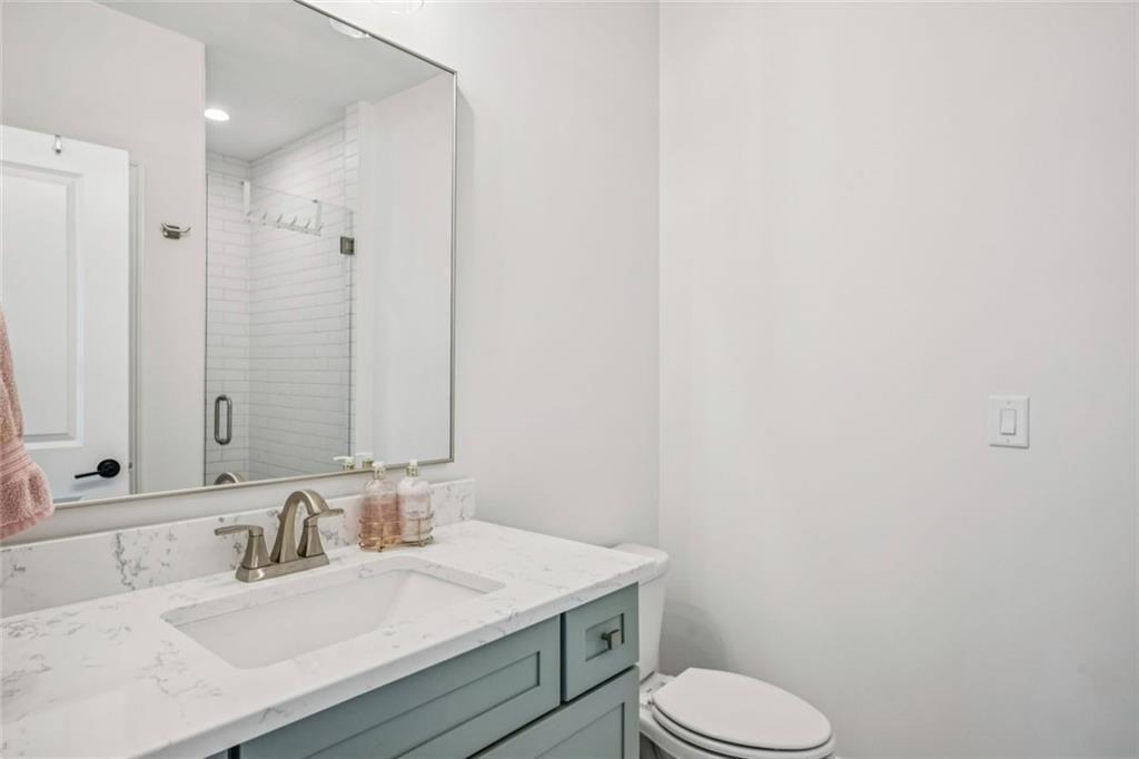 4081 Longleaf Lane Tucker, GA 30084 - Photo 29 of 49 a bathroom with a sink toilet and mirror