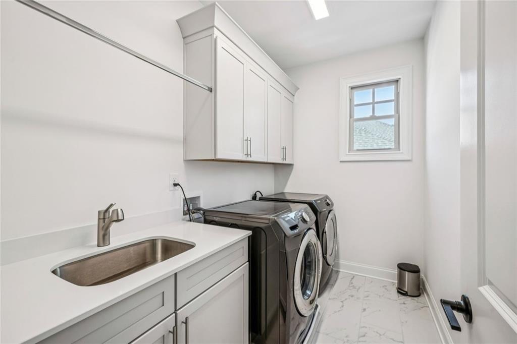 4081 Longleaf Lane Tucker, GA 30084 - Photo 30 of 49 a utility room with sink dryer and washer