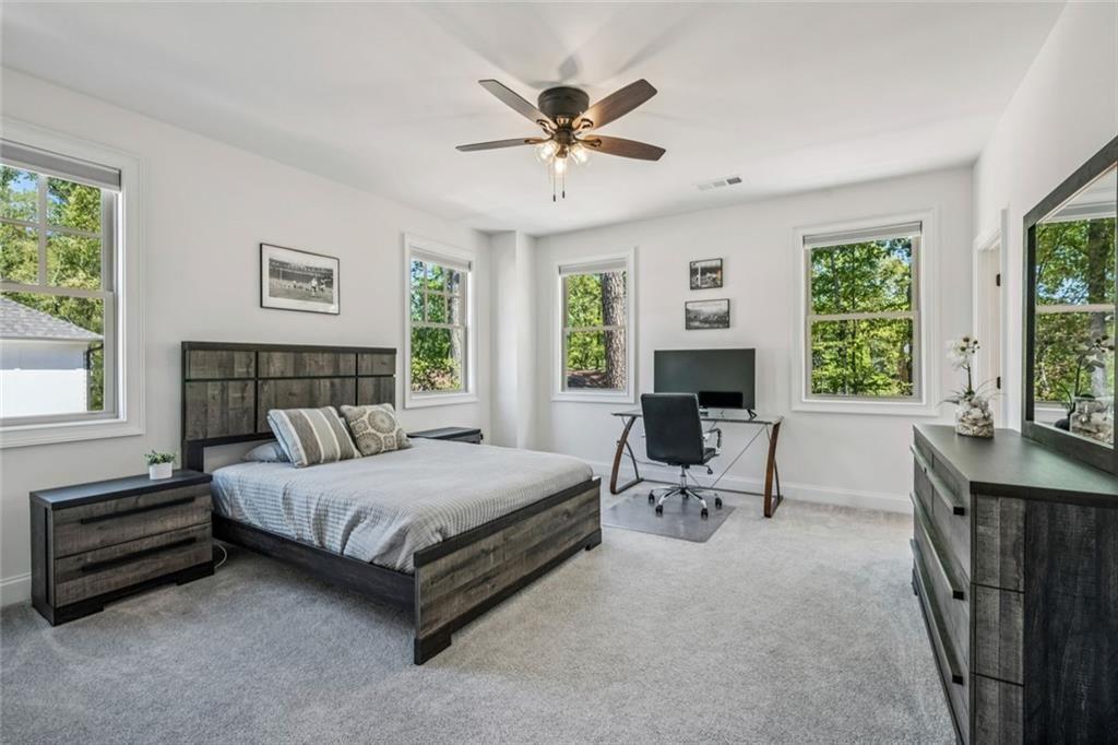 4081 Longleaf Lane Tucker, GA 30084 - Photo 31 of 49 a spacious bedroom with a bed and a window