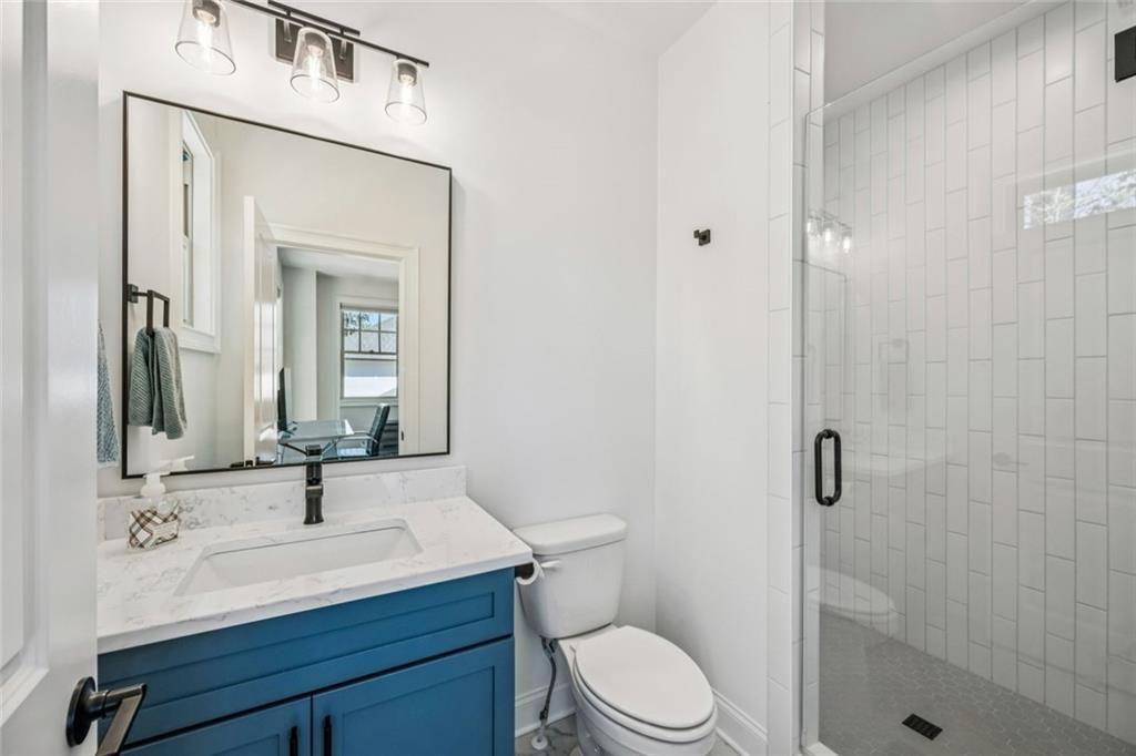 4081 Longleaf Lane Tucker, GA 30084 - Photo 32 of 49 a bathroom with a sink a toilet and shower