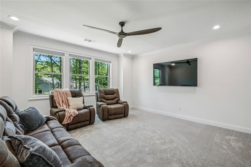 4081 Longleaf Lane Tucker, GA 30084 - Photo 33 of 49 a living room with furniture and a flat screen tv