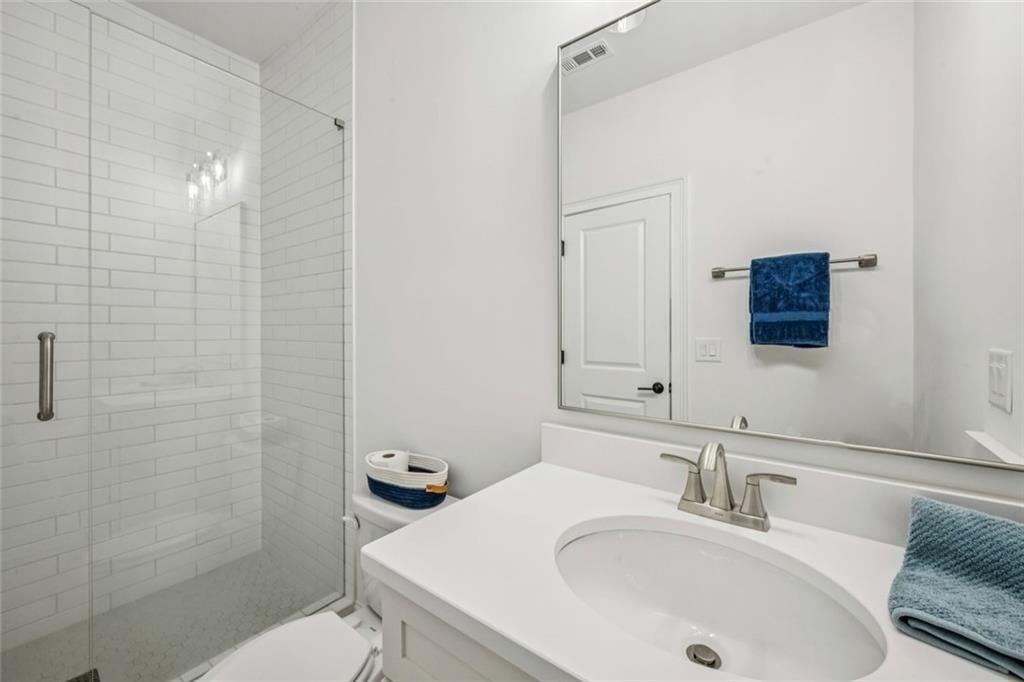 4081 Longleaf Lane Tucker, GA 30084 - Photo 35 of 49 a bathroom with a sink toilet and shower