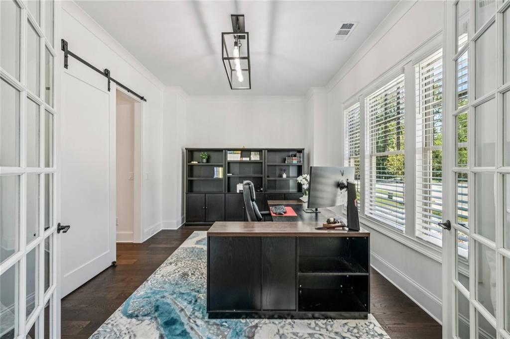 4081 Longleaf Lane Tucker, GA 30084 - Photo 36 of 49 a living room with furniture and a floor to ceiling window