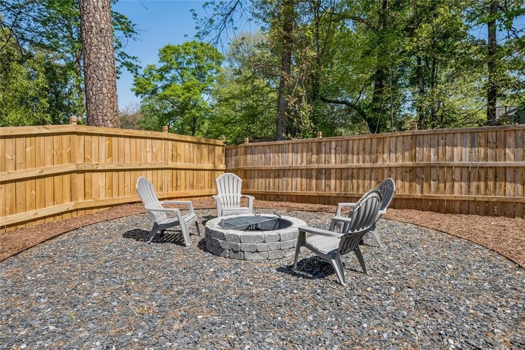4081 Longleaf Lane Tucker, GA 30084 - Photo 39 of 49 a lawn chair sitting in a backyard of a house