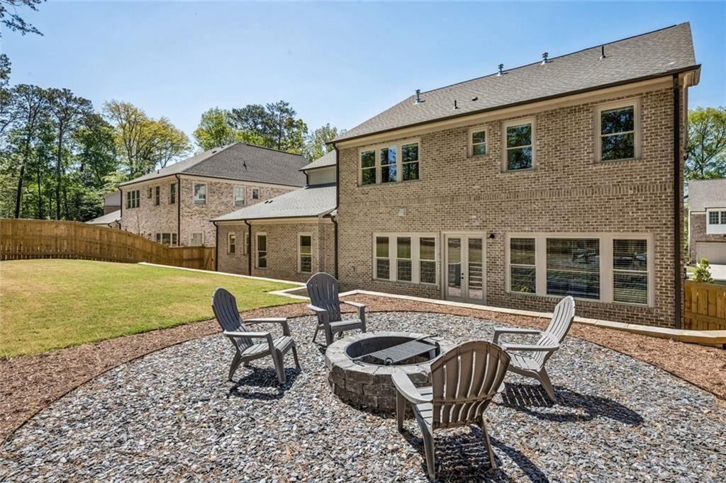 4081 Longleaf Lane Tucker, GA 30084 - Photo 40 of 49 a view of a house with backyard sitting area and garden