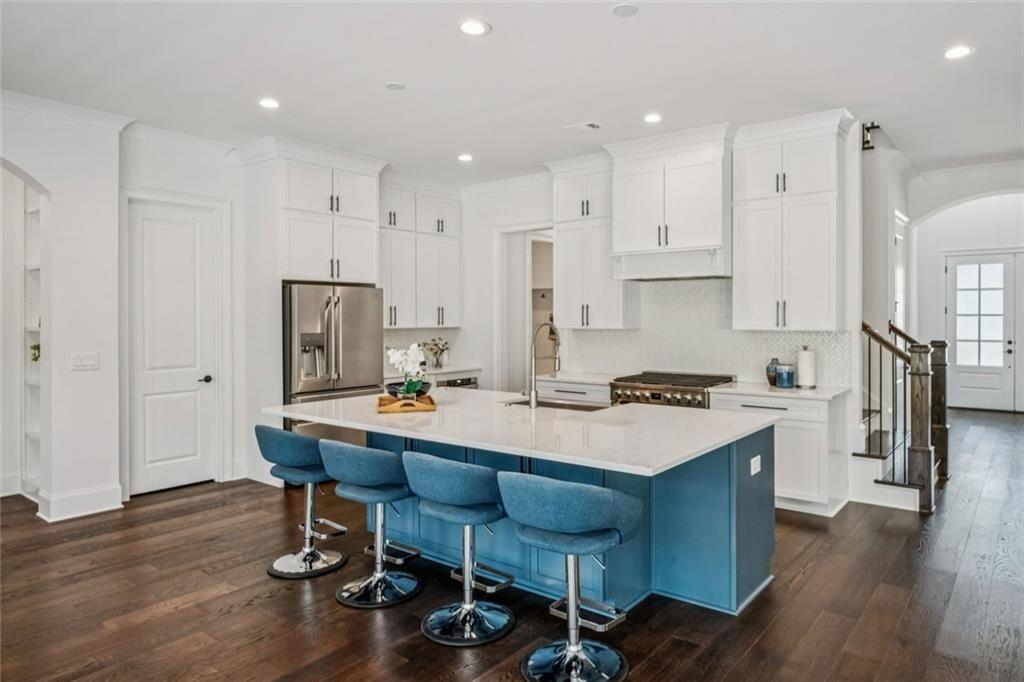 4081 Longleaf Lane Tucker, GA 30084 - Photo 10 of 49 a kitchen with stainless steel appliances a table and chairs in it