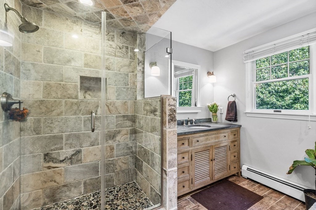18 Guide Post Pth Path Marshfield, MA 02050 - Photo 14 of 31 a bathroom with a granite countertop sink a vanity and a shower