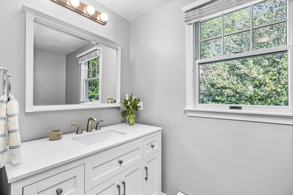 18 Guide Post Pth Path Marshfield, MA 02050 - Photo 18 of 31 a bathroom with a granite countertop sink and a mirror