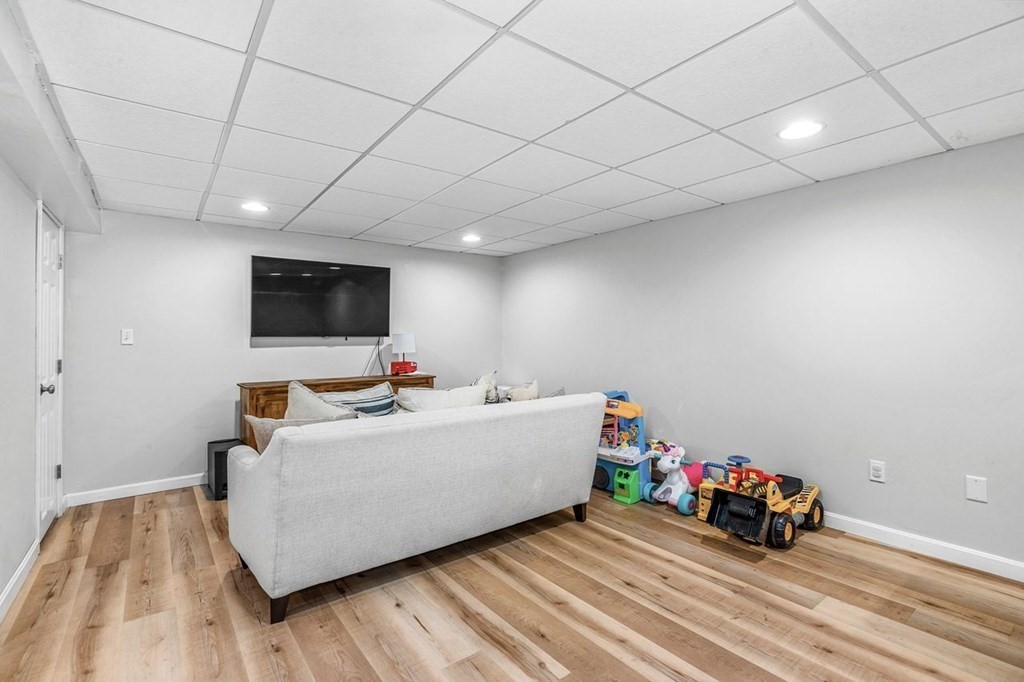 18 Guide Post Pth Path Marshfield, MA 02050 - Photo 21 of 31 a room with furniture and a flat screen tv