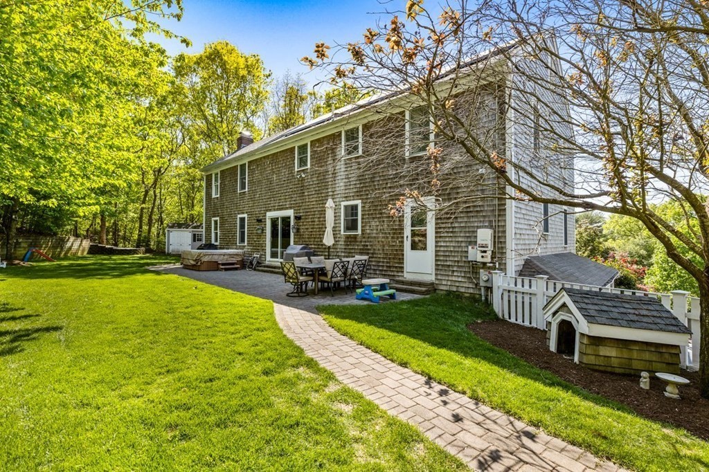 18 Guide Post Pth Path Marshfield, MA 02050 - Photo 24 of 31 a view of backyard of house with outdoor seating