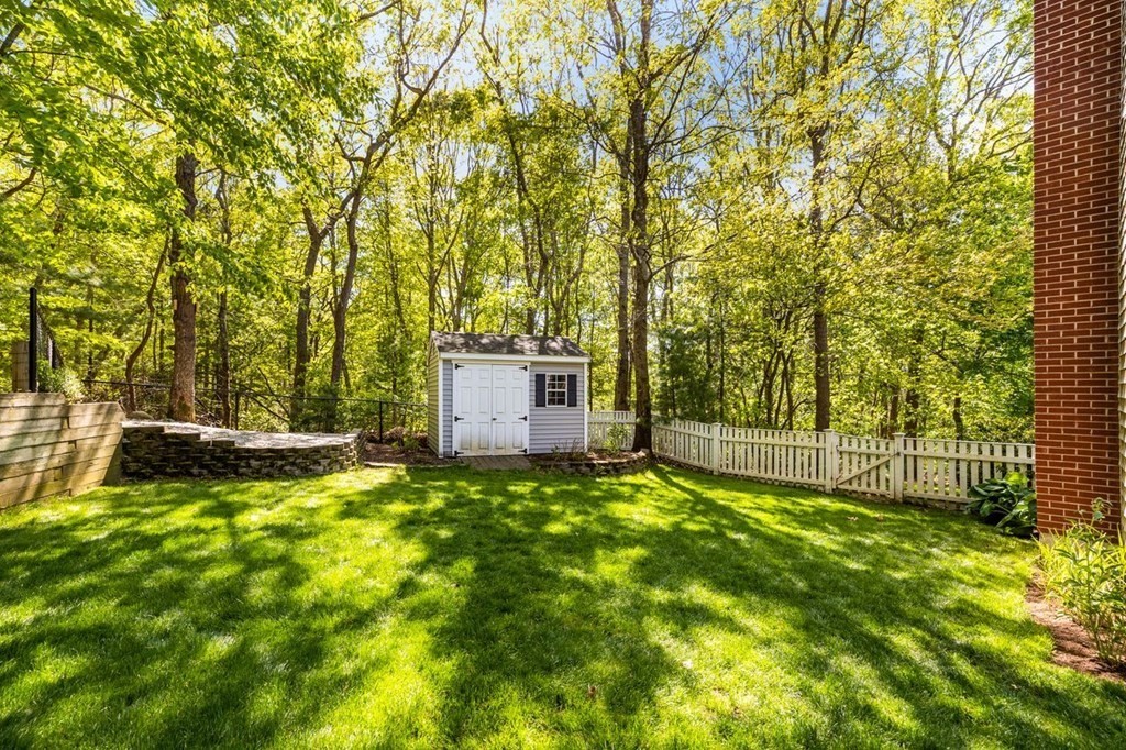 18 Guide Post Pth Path Marshfield, MA 02050 - Photo 26 of 31 a backyard of a house with table and chairs