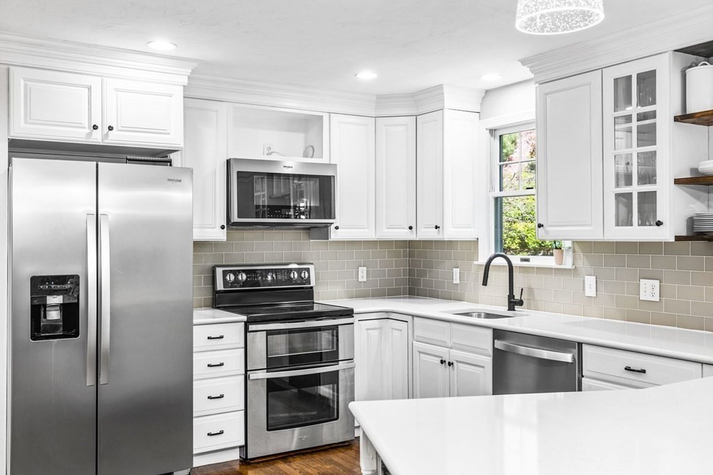 18 Guide Post Pth Path Marshfield, MA 02050 - Photo 5 of 31 a kitchen with cabinets stainless steel appliances and a counter space