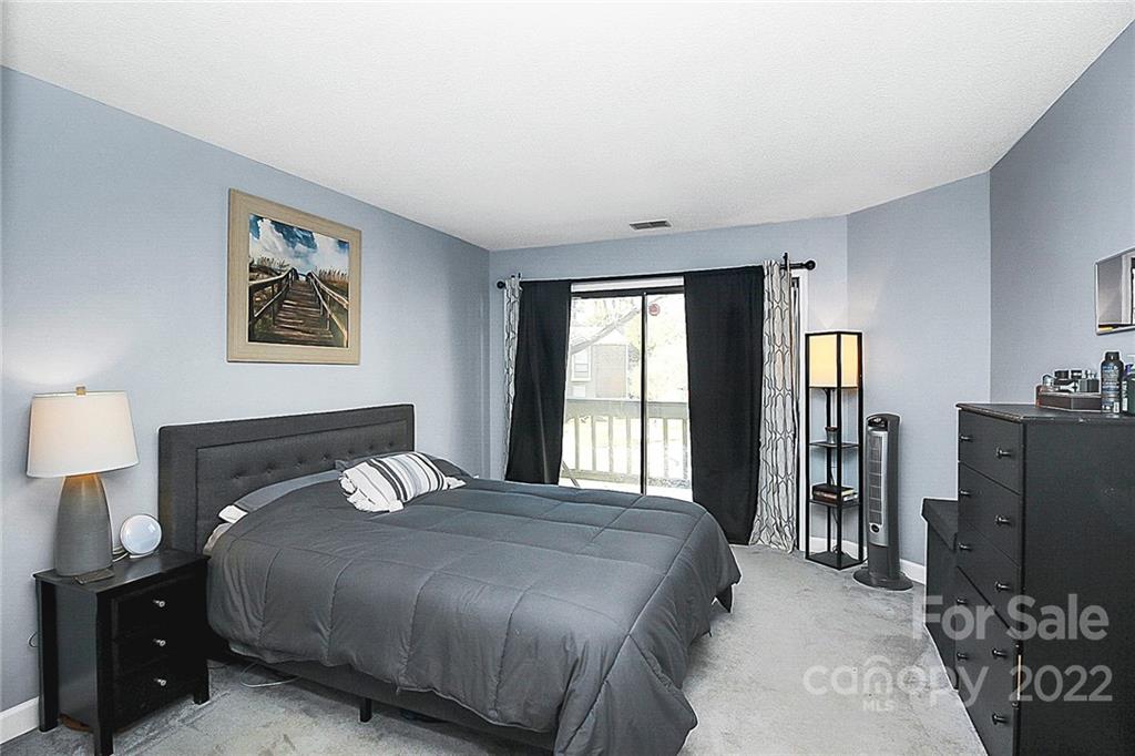 1612 Sharon Road West Charlotte, NC 28210 - Photo 18 of 25 a bedroom with a bed and a tv